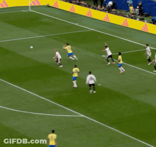 Soccer Players On Field With Yellow Adidas Banner GIF