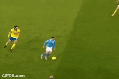 Soccer Players On Field With Yellow Shirt GIF