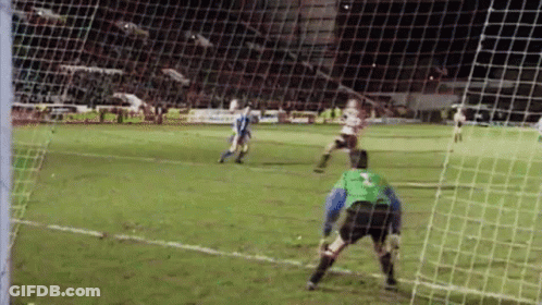 Soccer Players Playing At Night GIF