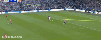 Soccer Players Playing On Field With Crowd GIF