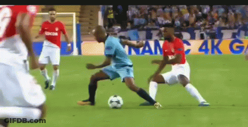Soccer Players Playing On Field With Sign Saying 4K G GIF