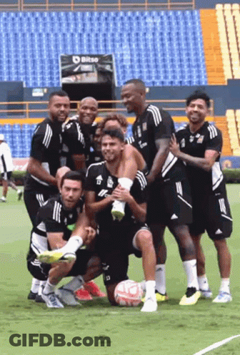 Soccer Players Posing For Photo On Field GIF