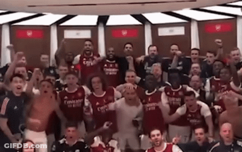 Soccer Players Posing In Dressing Room GIF