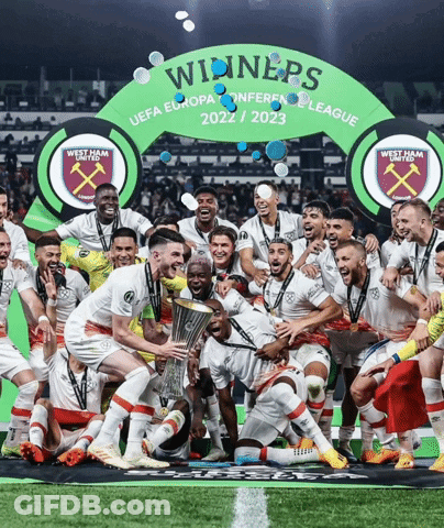 Soccer Players Posing In Front Of Winners Banner GIF