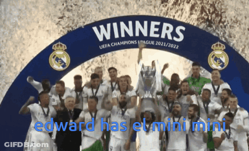 Soccer Players Posing In Front Of Winners Sign GIF