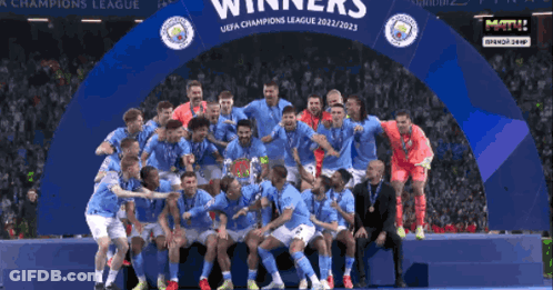 Soccer Players Posing Under Champions League Banner GIF