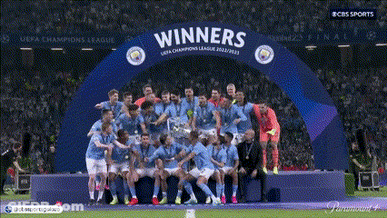 Soccer Players Posing Under Winners Arch GIF