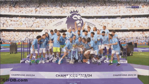 Soccer Players Posing With Champions 2022/24 Trophy GIF