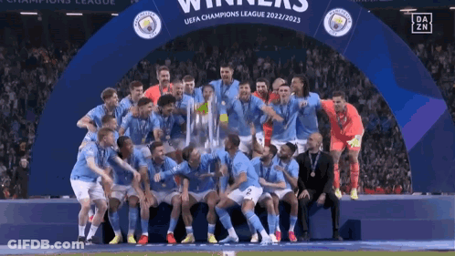 Soccer Players Posing With Champions League Trophy GIF