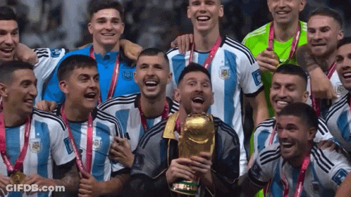 Soccer Players Posing With Trophy And Medals GIF