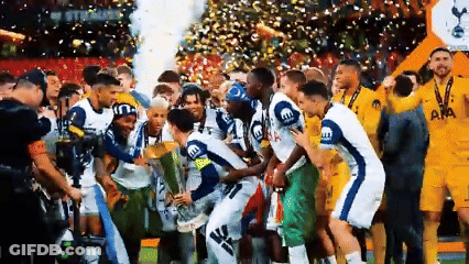 Soccer Players Posing With Trophy GIF