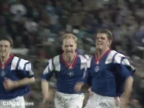 Soccer Players Running In Blue And White Uniforms GIF
