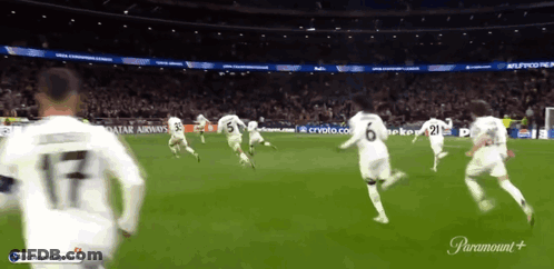 Soccer Players Running On Field With Paramount Ad GIF