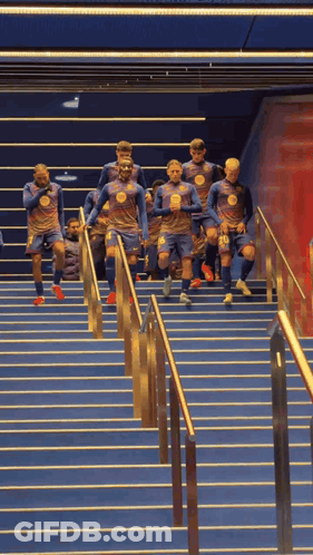 Soccer Players Running Up Stairs GIF