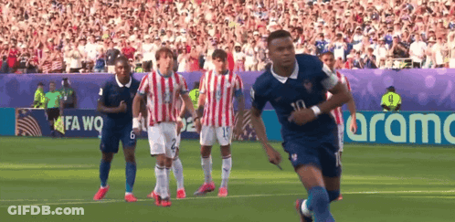 Soccer Players Running With Aramc Banner GIF
