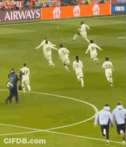 Soccer Players Running With FedEx Ad GIF