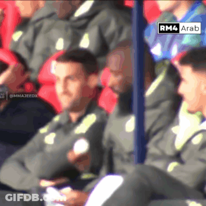 Soccer Players Sitting In Stadium With Sign Saying RM4 Ara GIF
