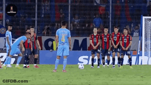 Soccer Players Standing In Front Of Sigma Sign GIF