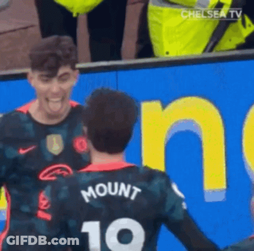 Soccer Players Standing Next To Each Other GIF