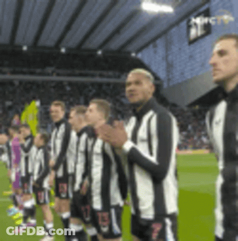 Soccer Players Standing On Field GIF