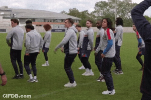 Soccer Players Standing On Field GIF