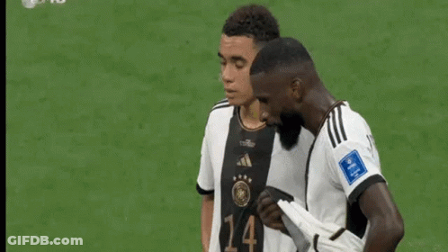 Soccer Players Talking On Field GIF