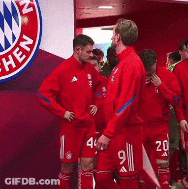 Soccer Players Walking In Front Of T-Mobile GIF