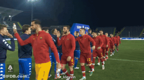Soccer Players Walking On Field With Serie A Sign GIF