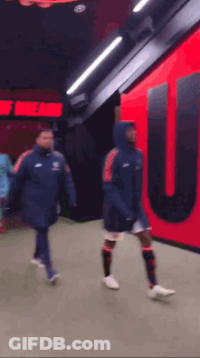 Soccer Players Walking Past Theatre Of Dreams GIF