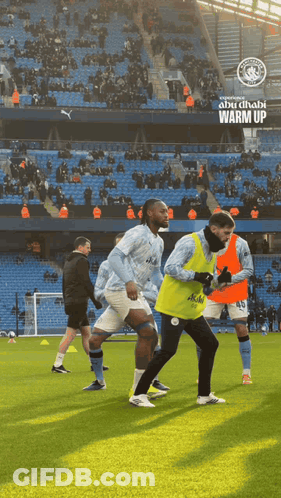 Soccer Players Warm Up In Abu Dhabi GIF