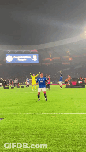 Soccer Players With Congratulations Banner GIF