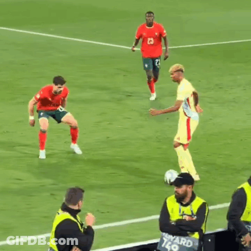 Soccer Players With Man In Yellow Vest Ward K9 GIF