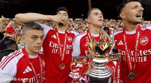 Soccer Players With Trophy And Emirates Fly Medals GIF