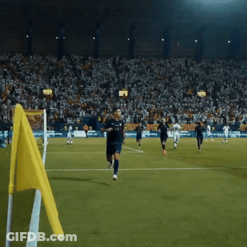 Soccer Players With Yellow Flag GIF