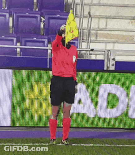 Soccer Referee Holding Yellow Flag Sign Adi GIF