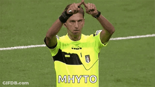 Soccer Referee In Yellow Shirt Making Heart Shape GIF