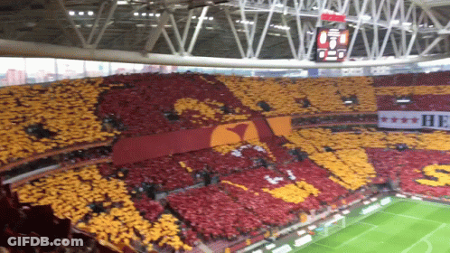 Soccer Stadium With Banner Saying He GIF