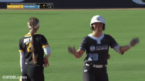 Softball Player Number 20 Celebrating With Teammate GIF