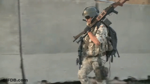 Soldier Carrying Gun Number 23 On Back GIF