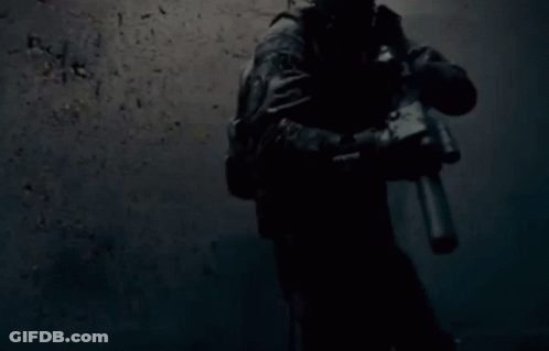 Soldier Holding Gun In Dark Room GIF