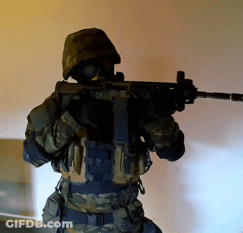 Soldier Holding Gun Wearing Gas Mask GIF