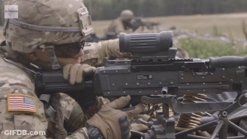 Soldier In AP26 Helmet Holding Machine Gun GIF