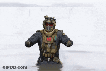 Soldier In Helmet And Goggles Dancing In Water GIF