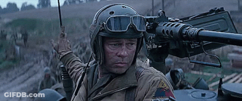 Soldier In Helmet And Goggles Pointing Gun GIF