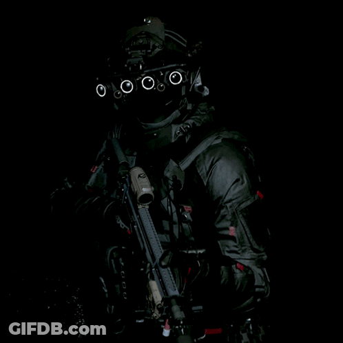 Soldier In Helmet With Circles Holding Gun GIF