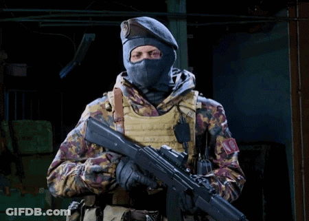Soldier In Mask And Beret Holding Rifle GIF