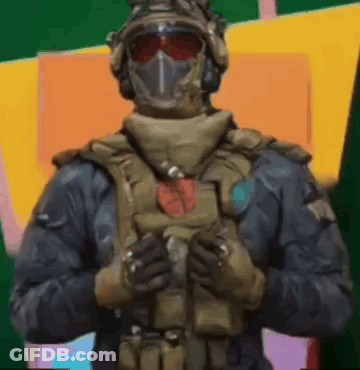 Soldier In Mask And Helmet With Folded Hands GIF