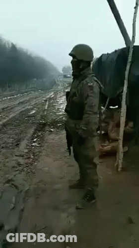 Soldier On Side Of Dirt Road GIF