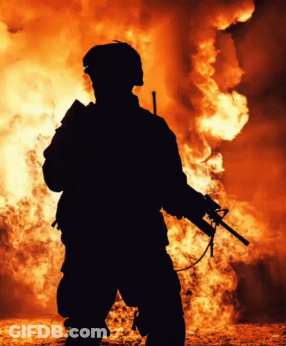 Soldier Silhouette Holding Gun By Fire GIF