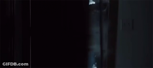 Soldier Standing In Doorway Holding Gun GIF